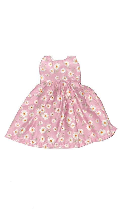 Pink floral dress on a white board