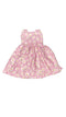 Pink floral dress on a white board