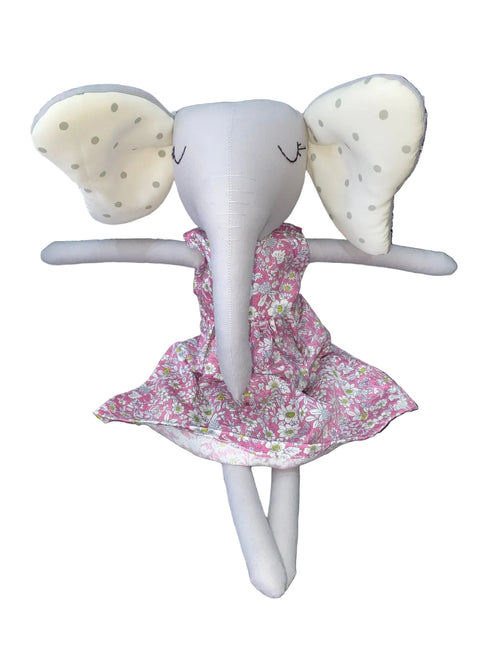 Toy elephant with a pink floral dress