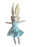 Toy rabbit in a blue dress on