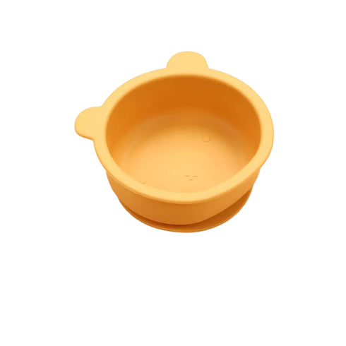 Yellow silicone bowl on a white background
