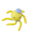Yellow knitted toy with a blue hat on a dark surface