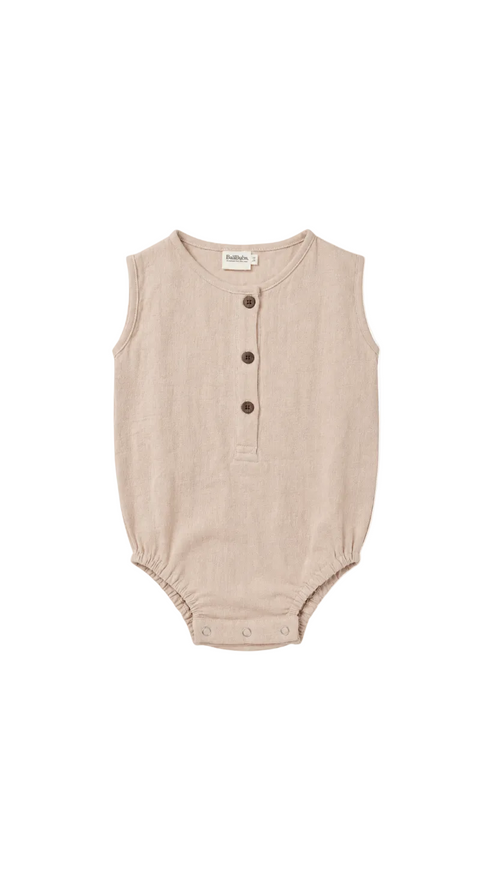 A sleeveless baby romper in a light beige linen-like fabric, featuring a three-button henley neckline and snap closures at the crotch