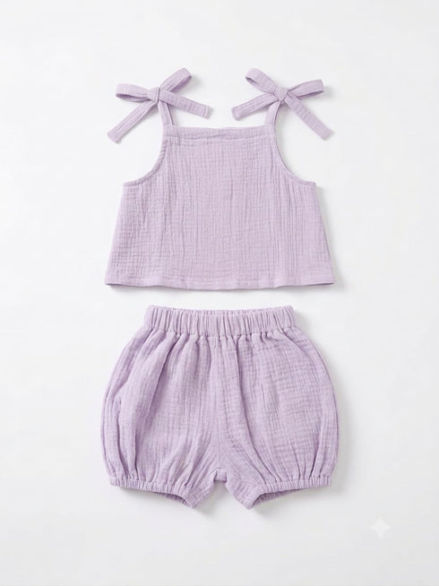 A two-piece baby outfit set in light purple/lavender textured gauze, featuring a sleeveless top with tie-shoulder straps and matching elastic-waist bloomers