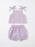 A two-piece baby outfit set in light purple/lavender textured gauze, featuring a sleeveless top with tie-shoulder straps and matching elastic-waist bloomers