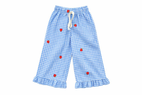 Blue checkered pants with red polka dots on a white background