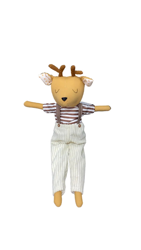 Stuffed toy deer in a striped shirt and pants
