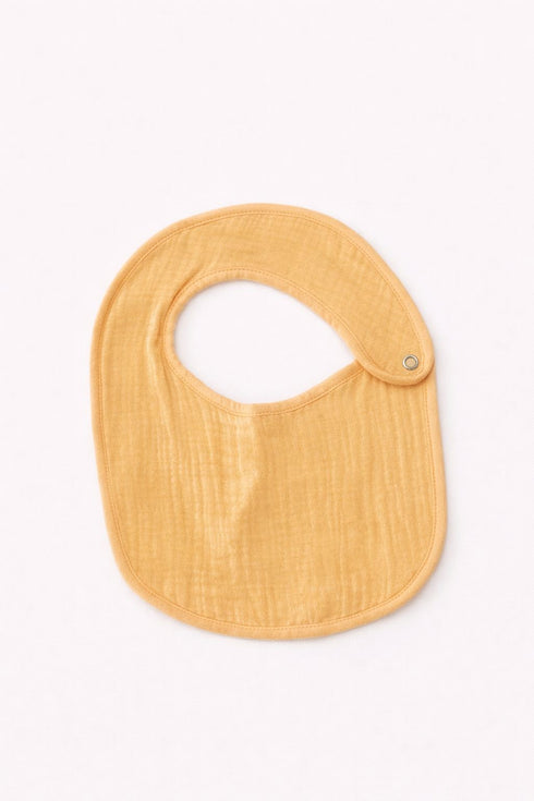 Yellow baby bib on a white background