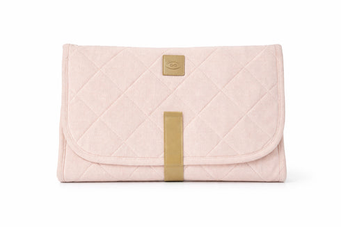 Pink quilted clutch bag with a gold strap and logo on a white background