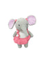 Crocheted elephant toy with a pink dress on a white board