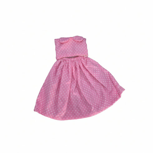 A pink strapless dress with white polka dots