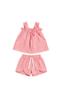 Pink and white striped children's outfit with top and shorts on a white background