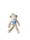 A crocheted plush monkey toy wearing a white sailor hat and a blue-and-white striped shirt