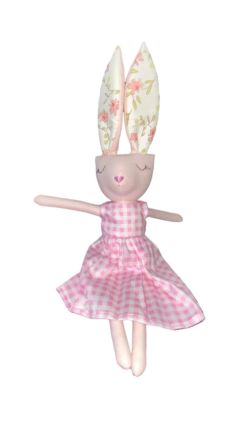 Toy figure with bunny ears and a pink dress