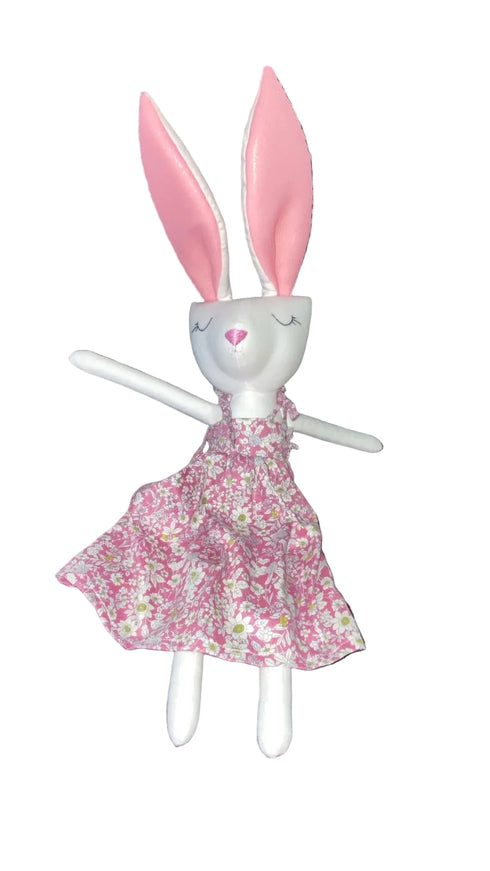 Plush toy rabbit in a floral dress