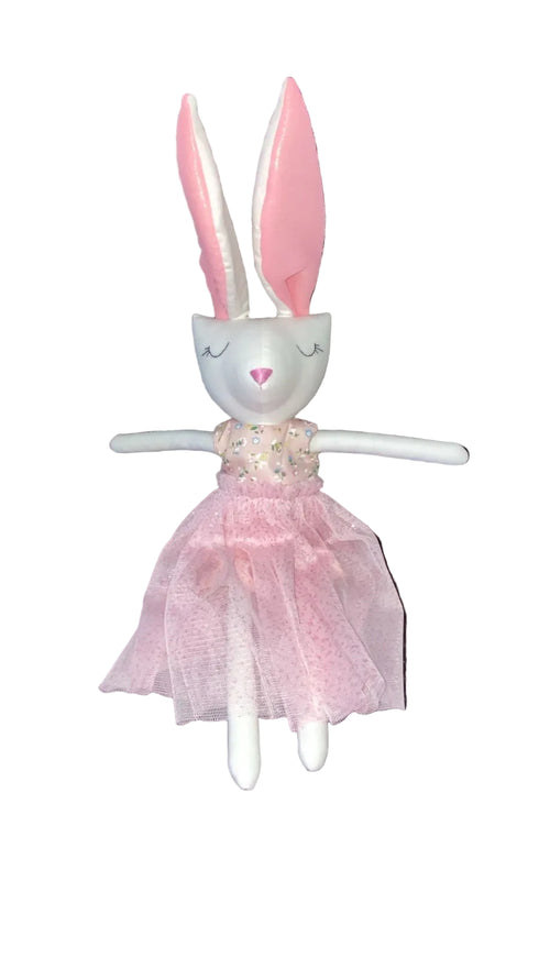Plush toy rabbit in a pink dress on a