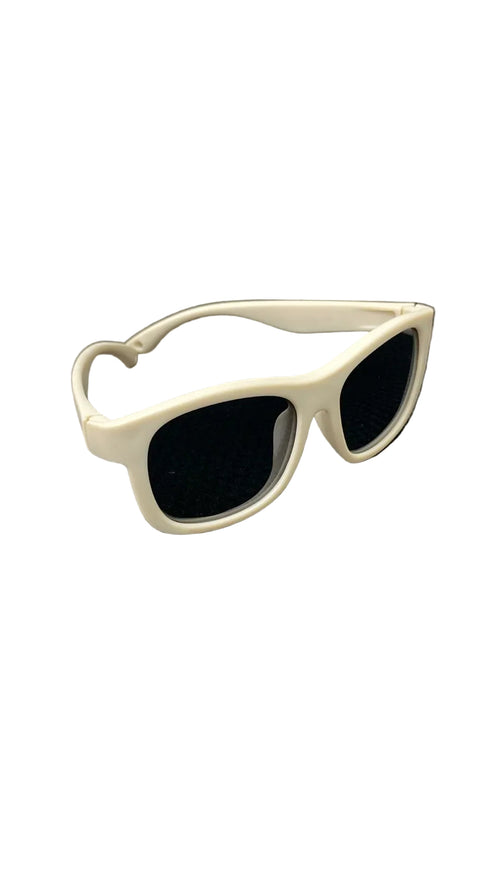 White sunglasses on a textured black surface