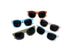 Five pairs of sunglasses on a white surface with a brand name visible.