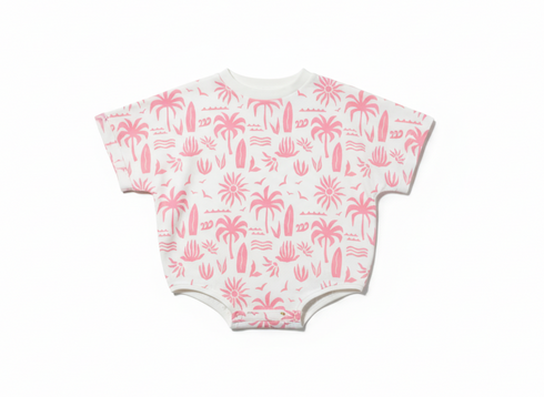 Baby onesie with pink palm tree pattern on a white background