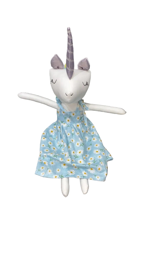 Stuffed animal with a blue dress featuring white flowers