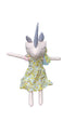 Stuffed toy with unicorn horn and floral dress on a chair