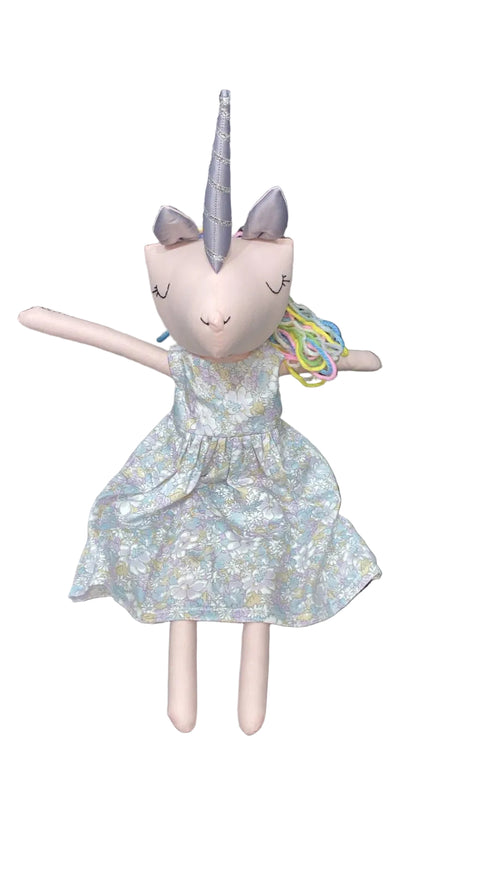 Unicorn plush toy with a dress