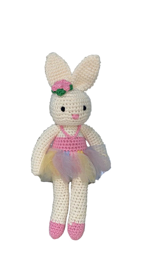 Crocheted bunny toy with a pink bow and tutu
