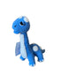 Blue dinosaur-shaped plush toy on a surface with a wooden background