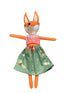 Stuffed fox toy with a red checkered shirt and green skirt on a white background