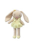 Crocheted bunny toy with a yellow dress on a white background